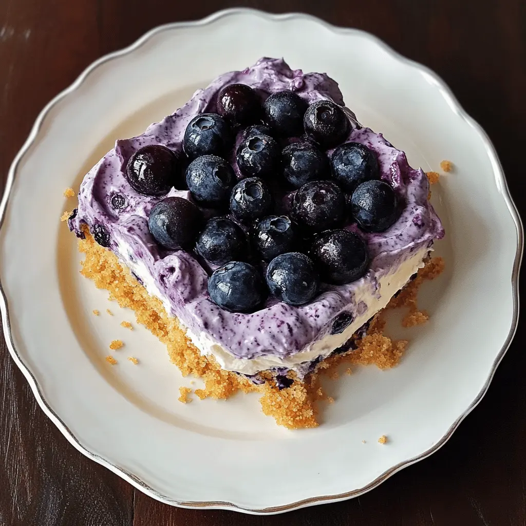 This No-Bake Blueberry Yum Yum is the perfect treat for busy days! Made with layers of creamy goodness, fresh blueberries, and a crumbly crust, it's both refreshing and satisfying. Easy to whip up for any occasion, you'll love how quickly it comes together. Save this pin and add this delicious dessert to your menu for your next gathering or family meal!