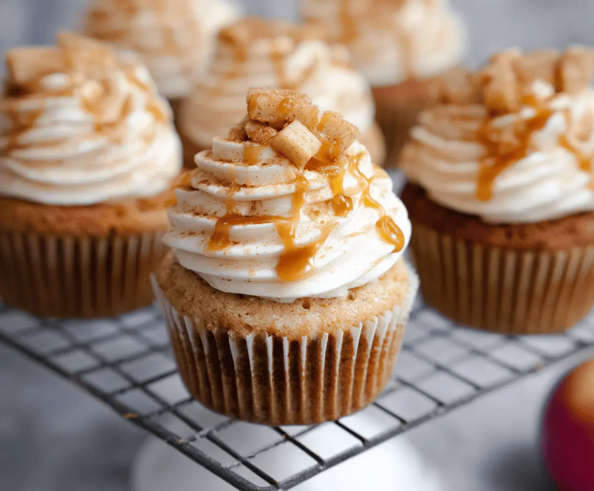 Delicious apple pie cupcakes with golden crust and cinnamon-spiced apple filling