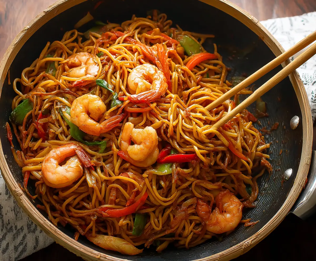 Delicious shrimp Lo Mein with colorful vegetables and noodles on a plate