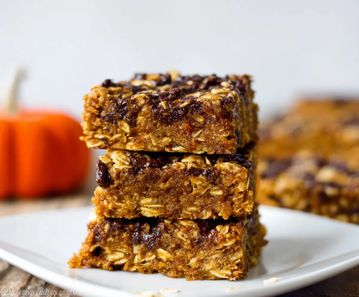 Delicious homemade pumpkin oatmeal bars with a golden crust and a cozy seasonal flavor.