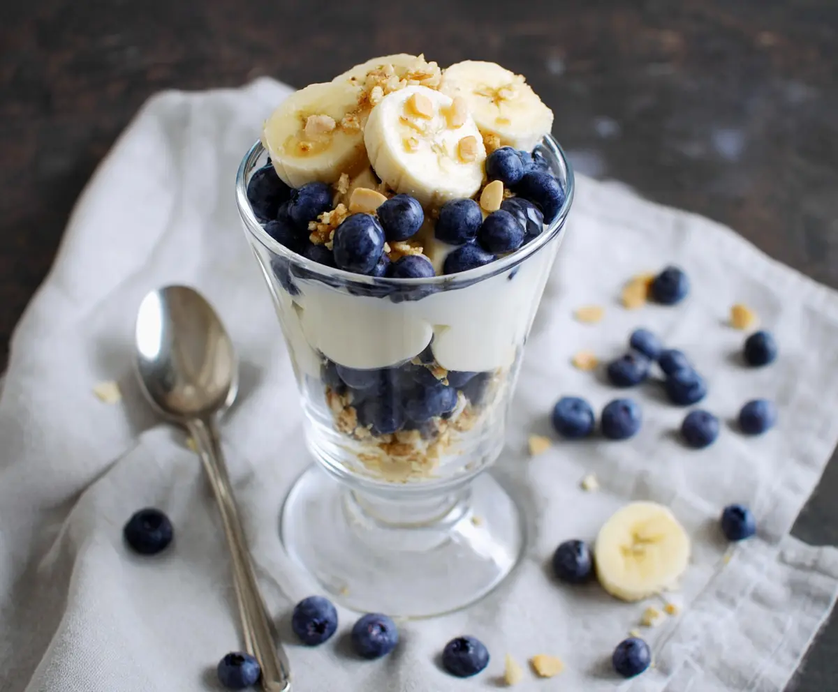 Delicious blueberry banana yogurt parfait layered with fresh fruit and creamy yogurt.