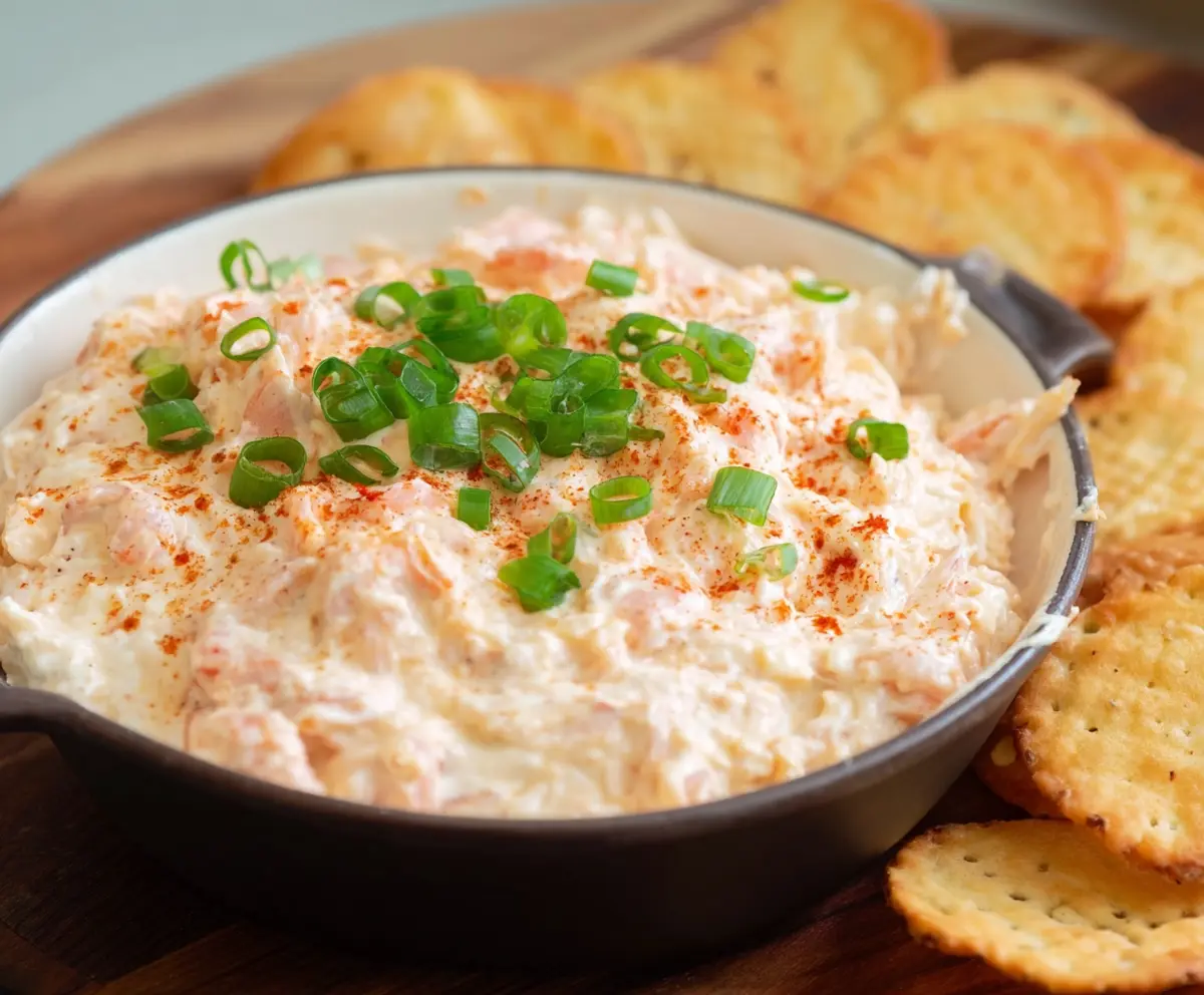 Cream Cheese Shrimp Dip served in a bowl with fresh herbs, perfect for appetizers.