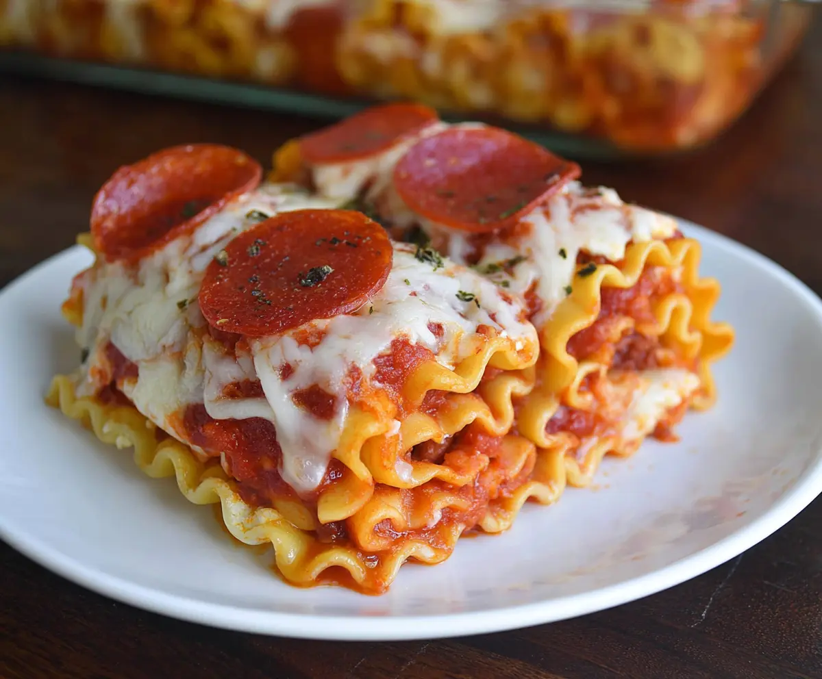 Delicious Pepperoni Pizza Lasagna Roll Ups with melted cheese and crispy edges ready to serve.