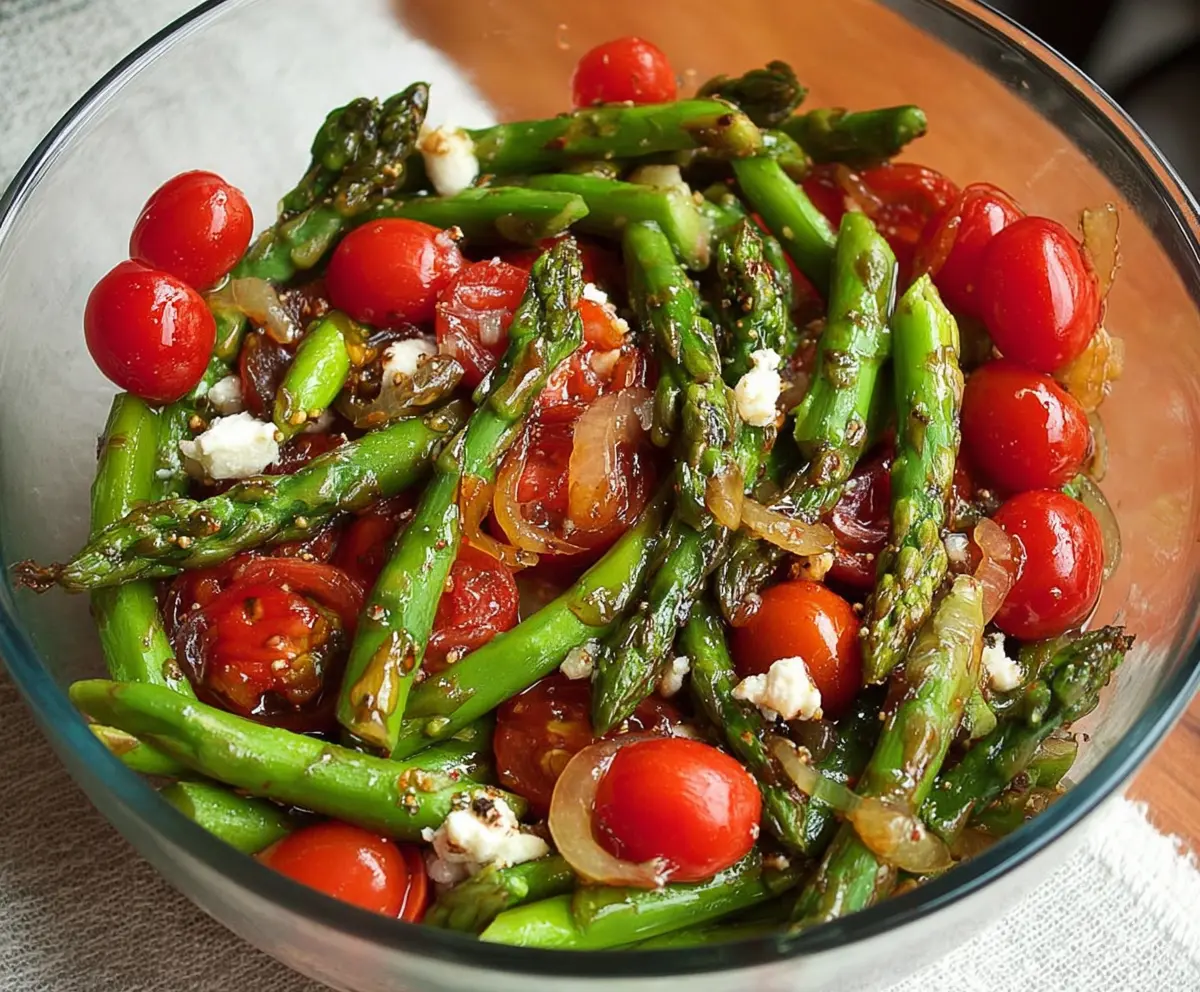 Fresh balsamic asparagus and tomato salad in a bowl, vibrant and healthy, perfect for a light lunch or dinner.