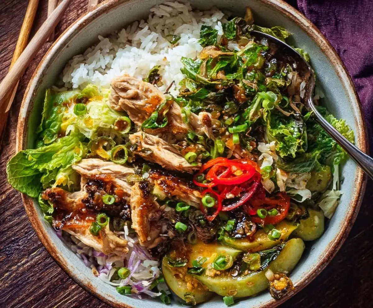 Delicious Ginger Scallion Chicken Bowl featuring tender chicken slices topped with fresh scallions and aromatic ginger.